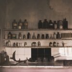 a kitchen filled with lots of bottles and knives