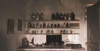 a kitchen filled with lots of bottles and knives